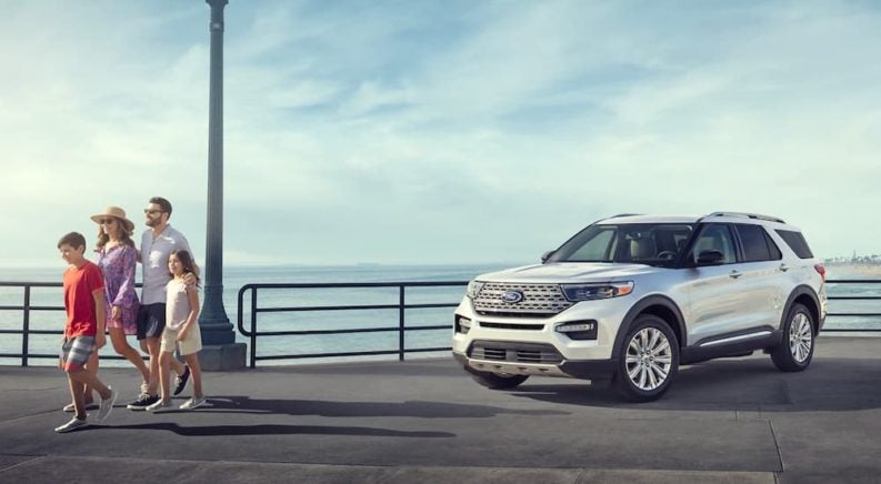 A family walks away from their parked 2023 Ford Explorer.