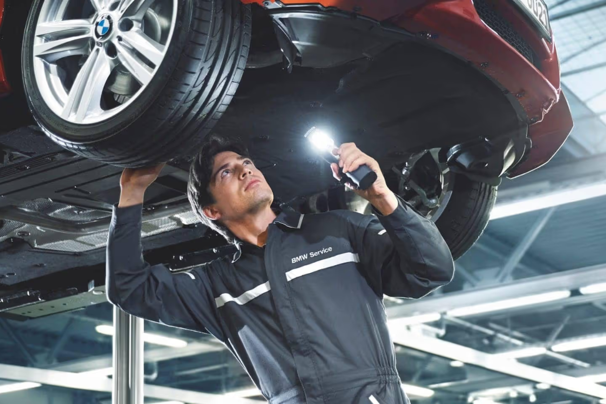 BMW Certified Vehicle Inspection BMW-trained technician completing a BMW Certified vehicle inspection