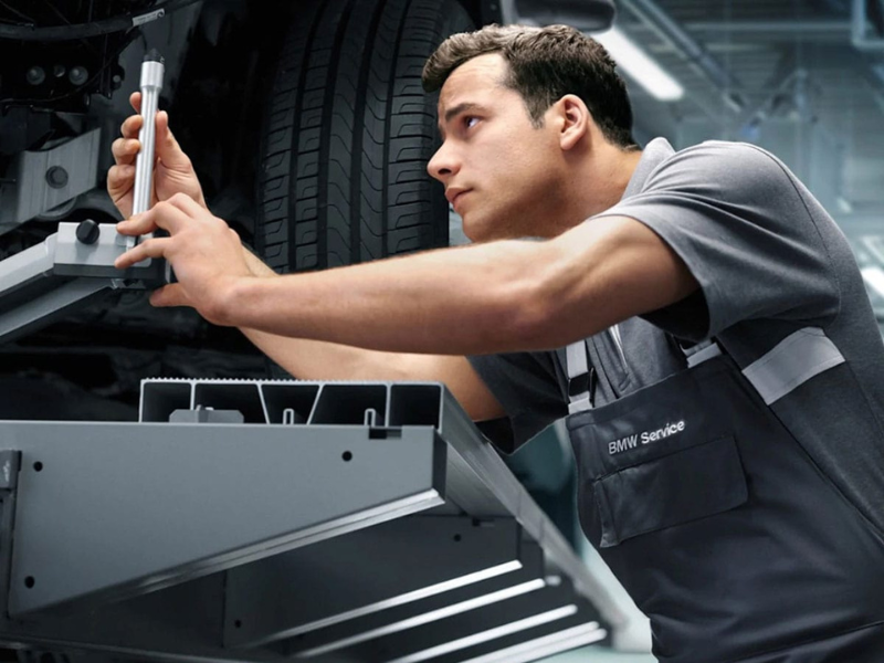 BMW tire being inspected during BMW service in Grand Blanc