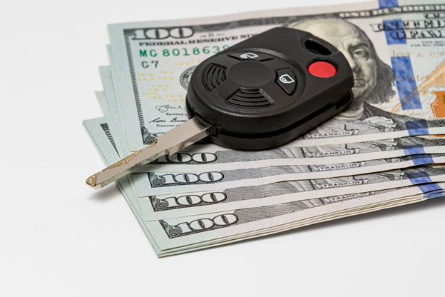 Car keys on top of money