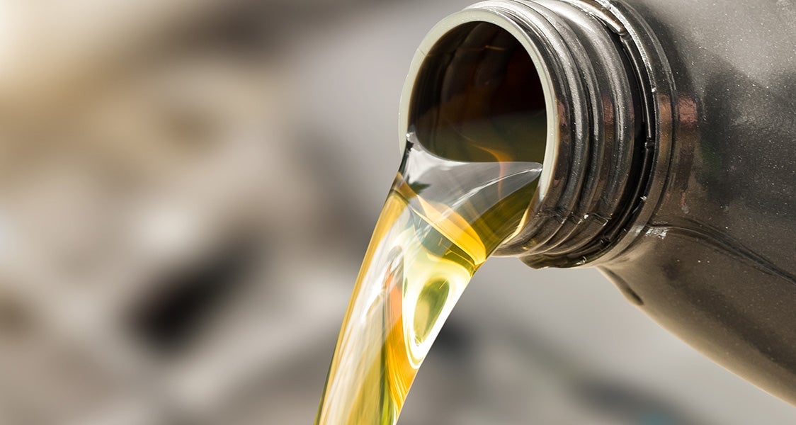 Oil being poured into an engine
