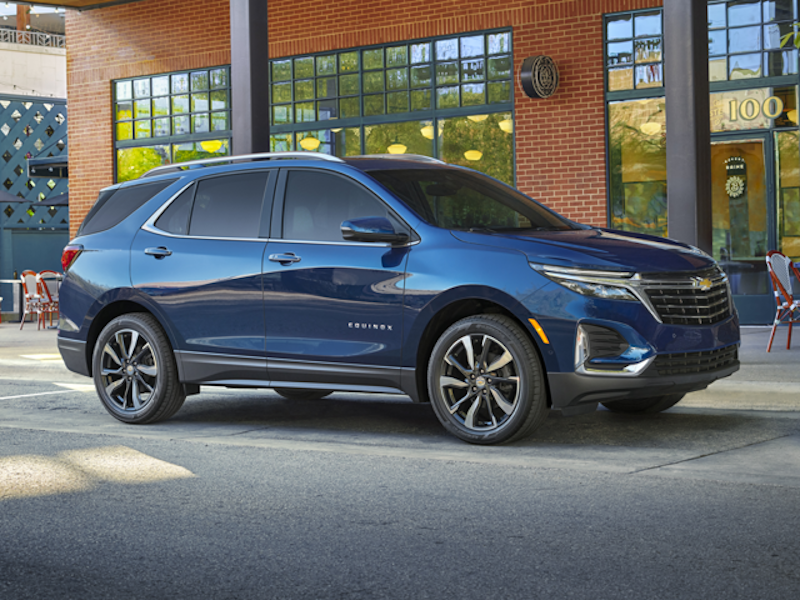 The 2024 Chevrolet Equinox sitting in front of a nice warehouse