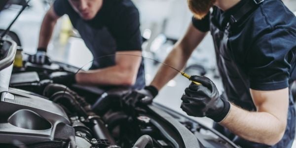 Mechanics working on vehicle