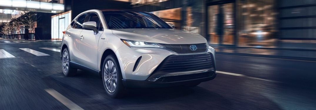 White 2021 Toyota Venza Front Exterior on City Street at Night