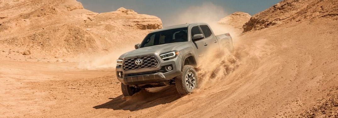 Gray 2020 Toyota Tacoma Driving Through Sand