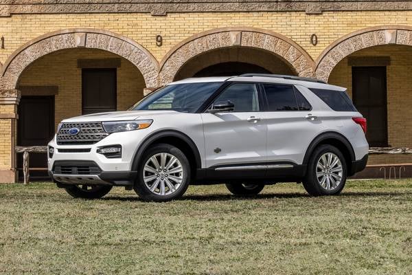 A white 2022 Ford Explorer parked on a lawn.