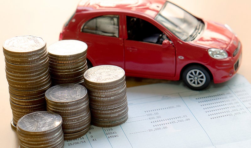 Red car and deck of coins