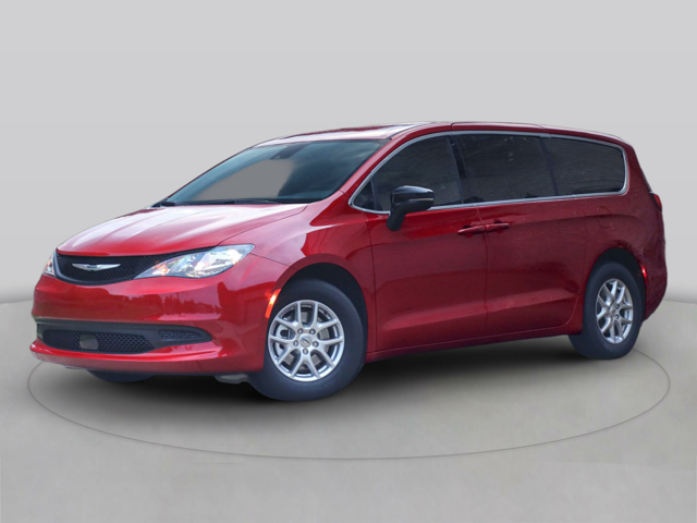 A photo of a red 2025 Chrysler Voyager