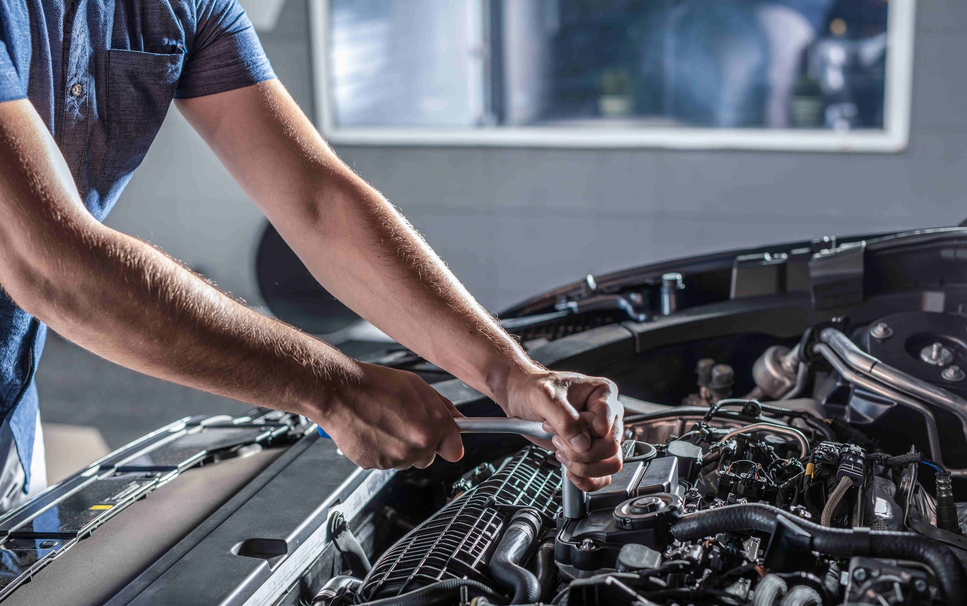 Jeep service technician working on a vehicle