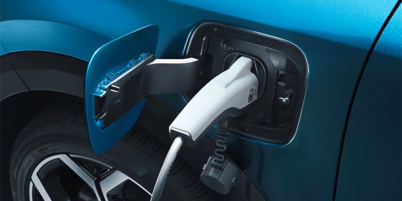 A 2025 Kia Niro Plug-in Hybrid charging in Alliance, OH