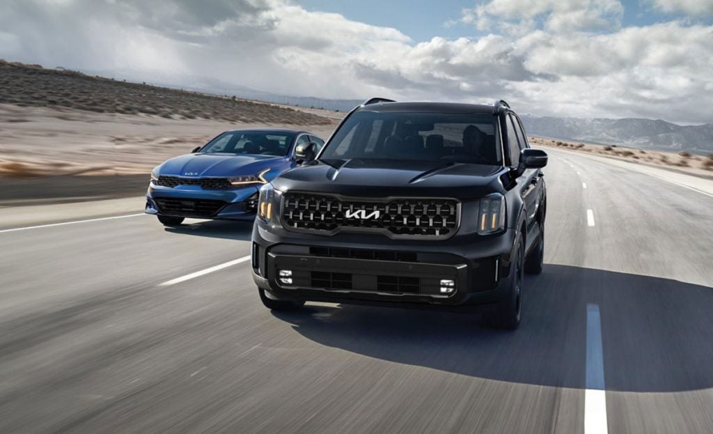 Kia Models moving in a desert area.