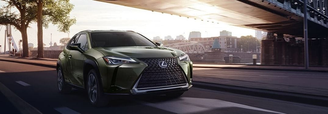 Green 2020 Lexus UX Driving Under a Bridge