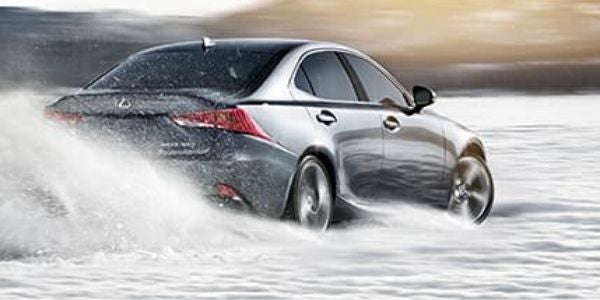 Silver 2020 Lexus IS with AWD Driving in Snow