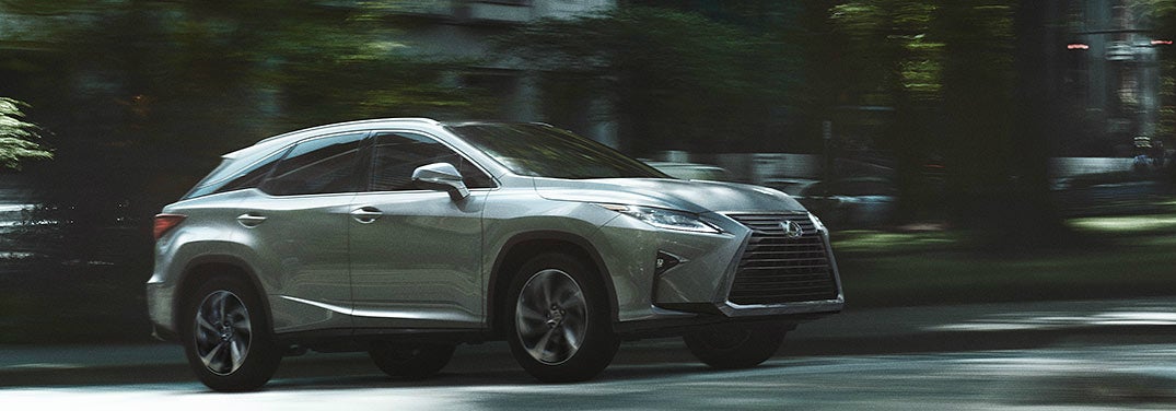 Lexus RX 350 drives up a road.
