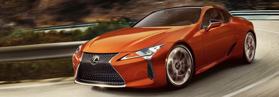Orange 2021 Lexus LC Coupe on a Mountain Highway