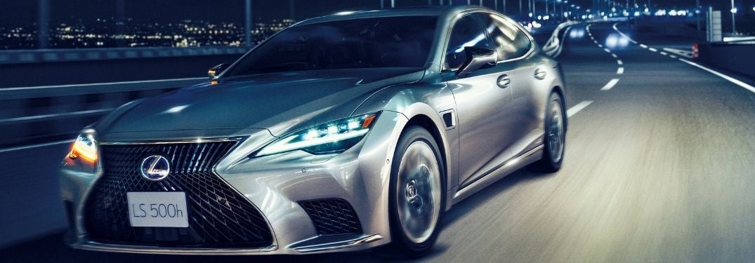 Silver 2022 Lexus LS 500h on a Freeway at Night