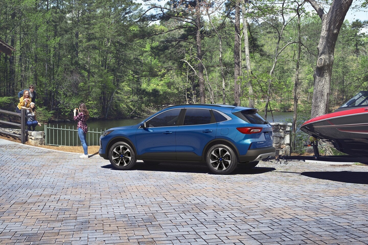 2023 Ford Escape hauling a small boat at a lake