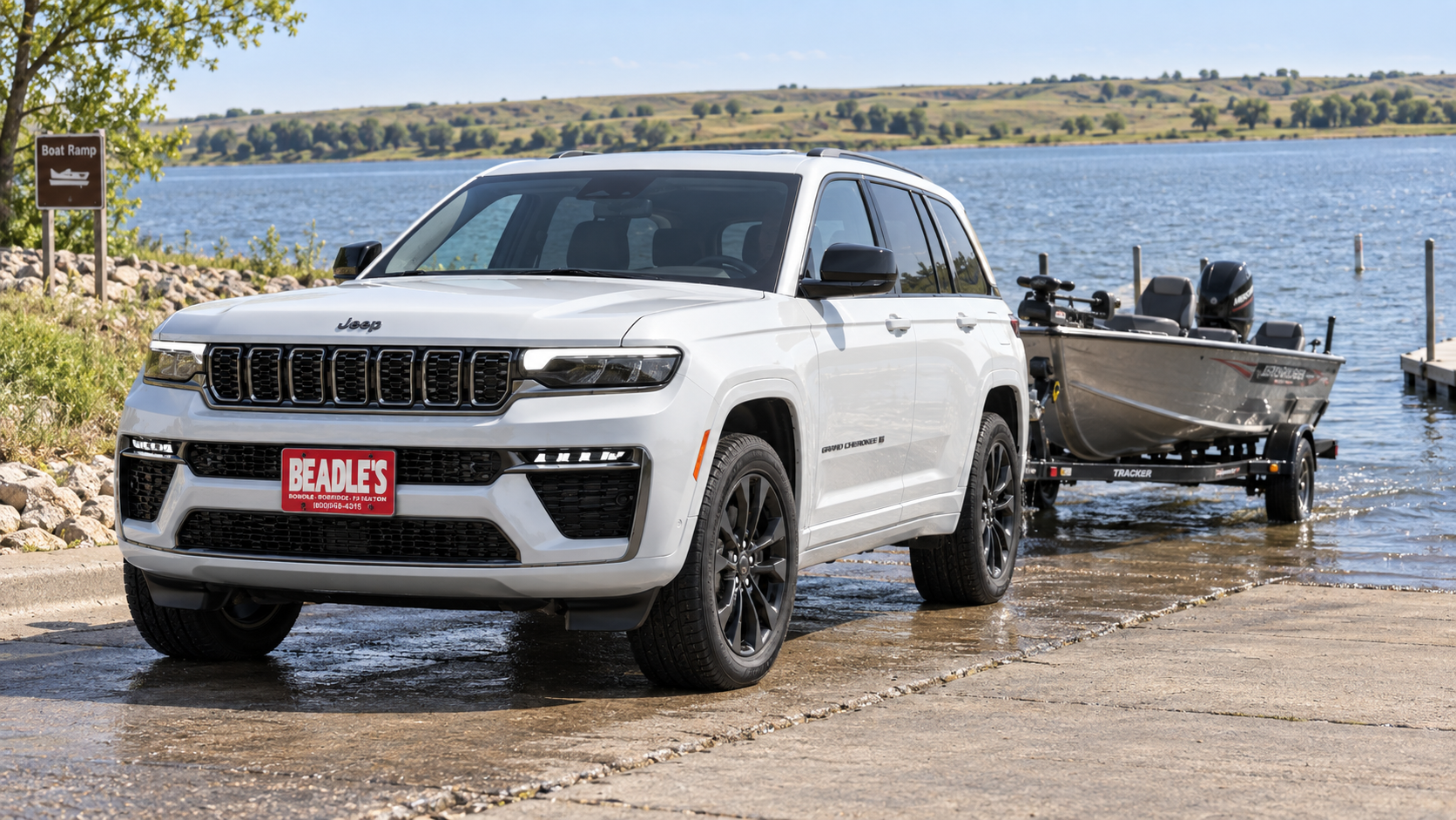 2026 Jeep Grand Cherokee towing a boat, towing guide, at Beadle's Chrysler Center