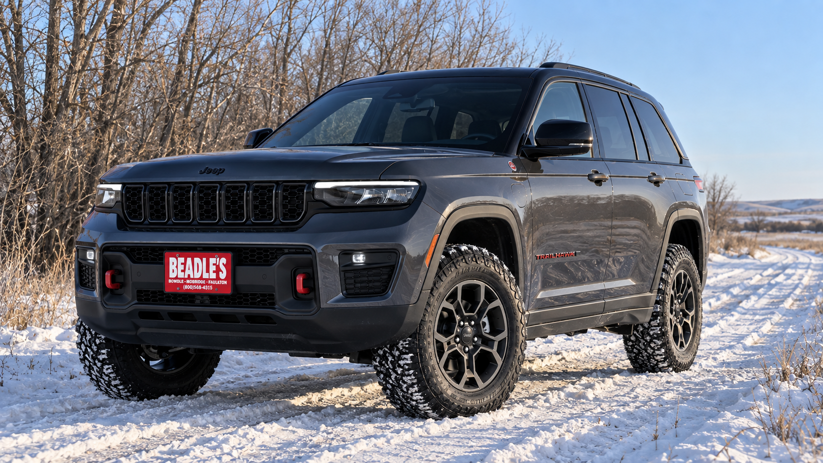 2027 Jeep Grand Cherokee Trailhawk 4x4 in the snow, at Beadle's Chrysler Center