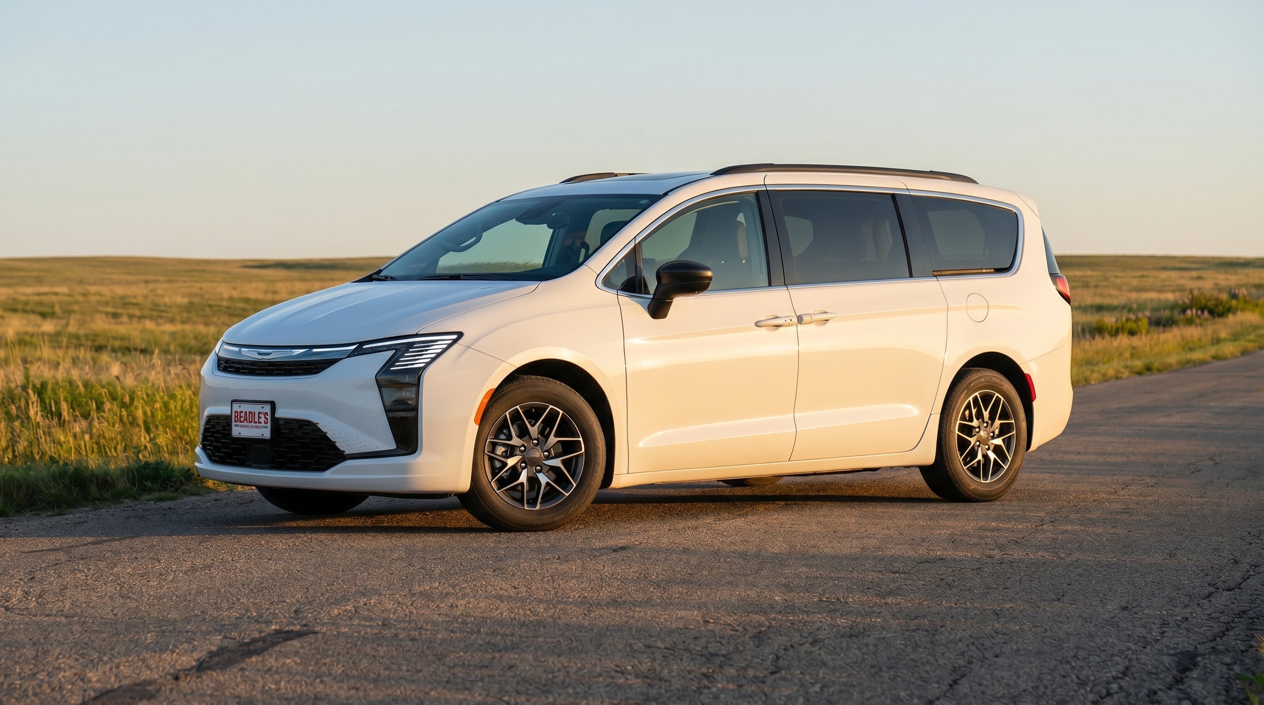 2027 Chrysler Pacifica side profile on a rural South Dakota road