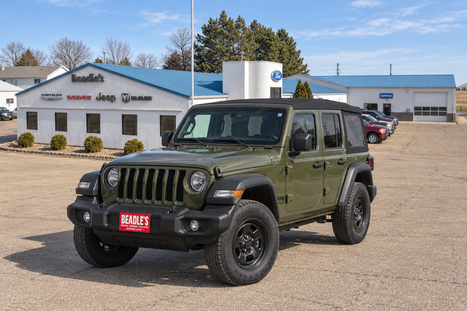 2026 Jeep Wrangler Sport in front of Beadle's Chrysler Center in Bowdle, SD