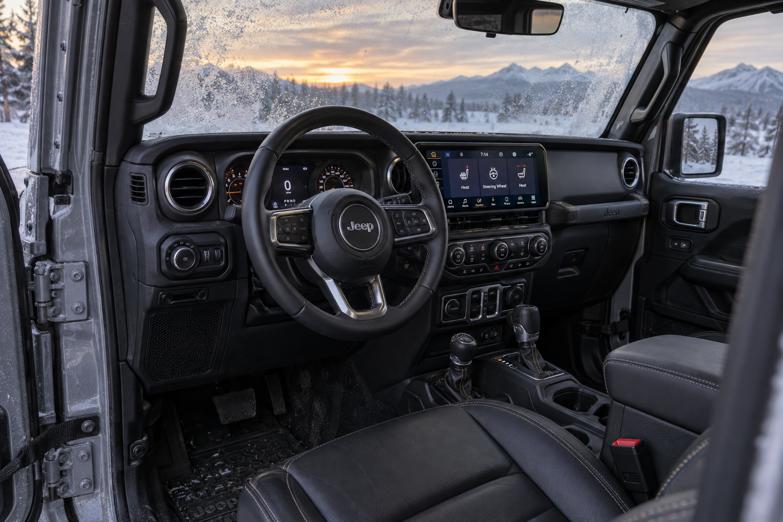 2026 Jeep Wrangler interior with the 12.3-inch Uconnect touchscreen and frost on the windows outside, at Beadle's Chrysler Center