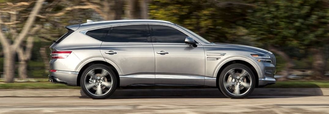 Silver 2021 Genesis GV80 Side Exterior on a City Street