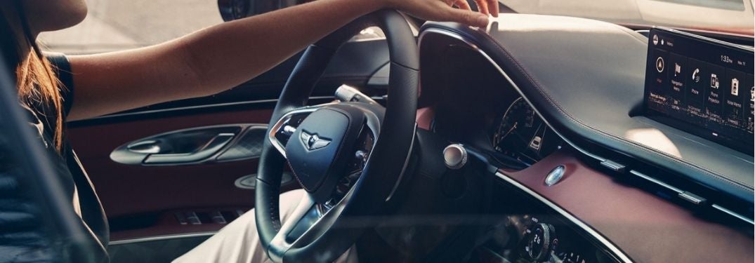Woman Driving a 2022 Genesis GV70