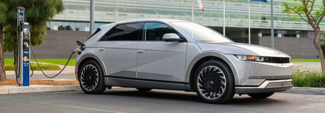 Silver 2022 Hyundai IONIQ 5 Charging in a Parking Lot