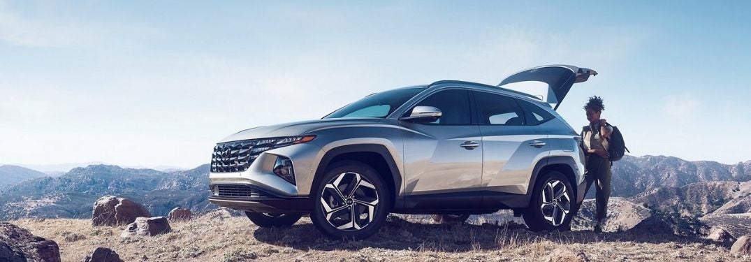 Woman Unloading Cargo from Silver 2022 Hyundai Tucson