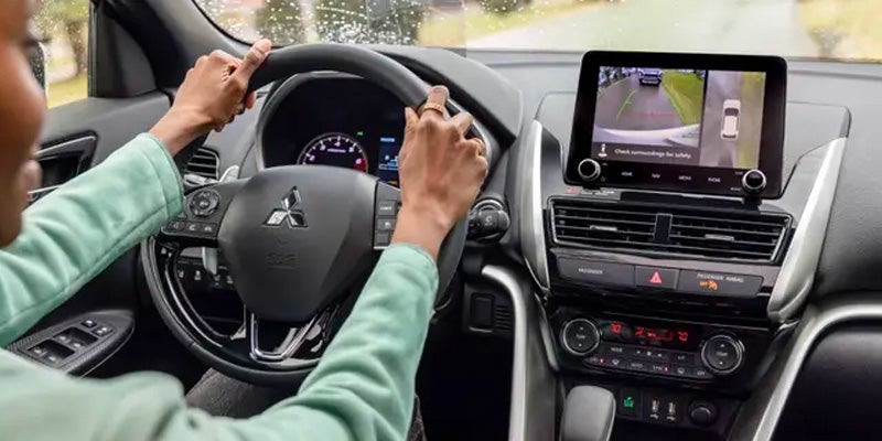 A woman driving a car.