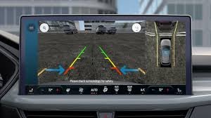 A driver using the 360-degree camera system on the Ford Escape's large center touchscreen.