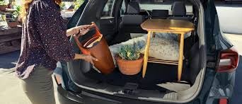 Interior view of the Ford Escape with rear seats folded down, showing the spacious cargo area.