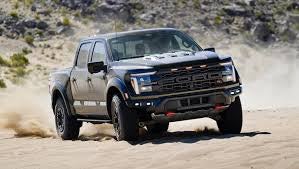 The aggressive front end of the F-150 Raptor with FOX racing shocks visible