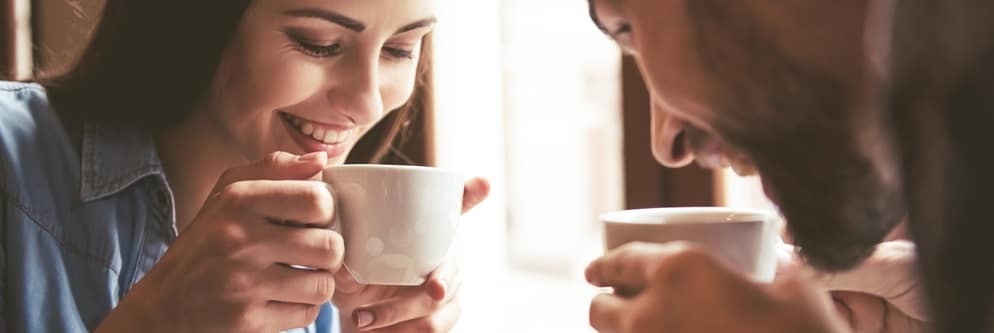 Couple drinking coffee at coffee shop