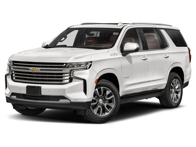 A white Chevrolet Tahoe SUV with a chrome grille, brown interior, and roof rails, angled slightly right.