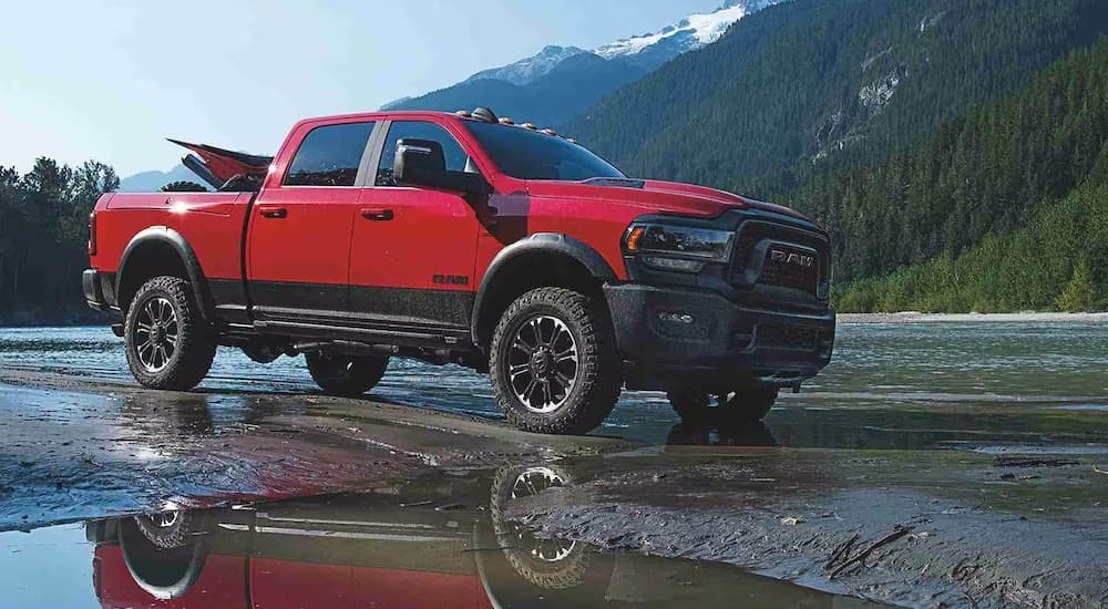 A red 2025 Ram 2500 is shown from the side after leaving a Ram dealer near Springfield.