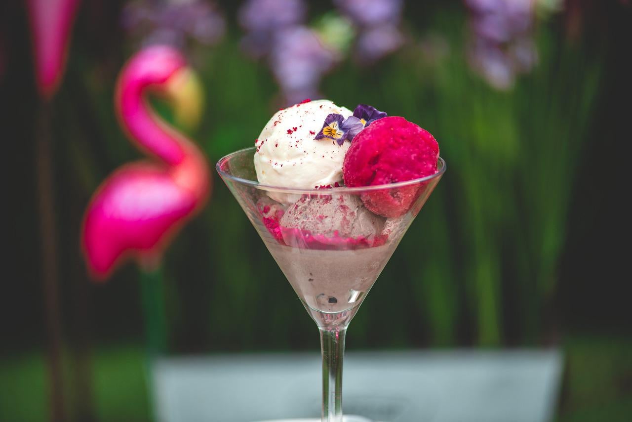 Vanilla Strawberry and chocolate Ice-Cream scoops in a coup.