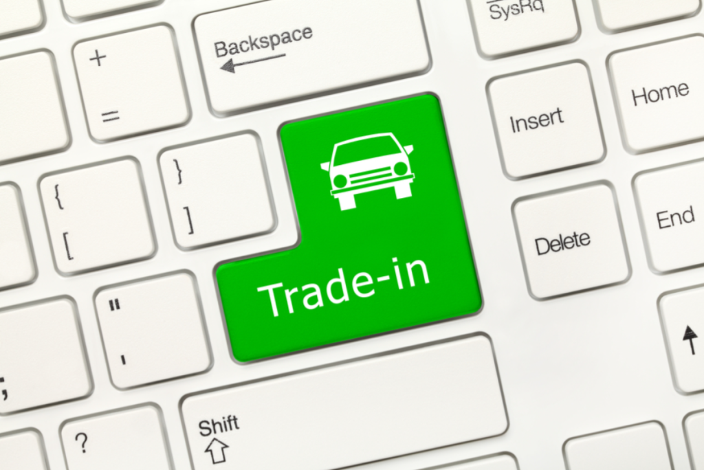 Keyboard with large green button labeled Trade-In