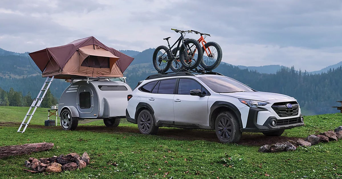 2024 Subaru Outback with bikes on top hauling a trailer