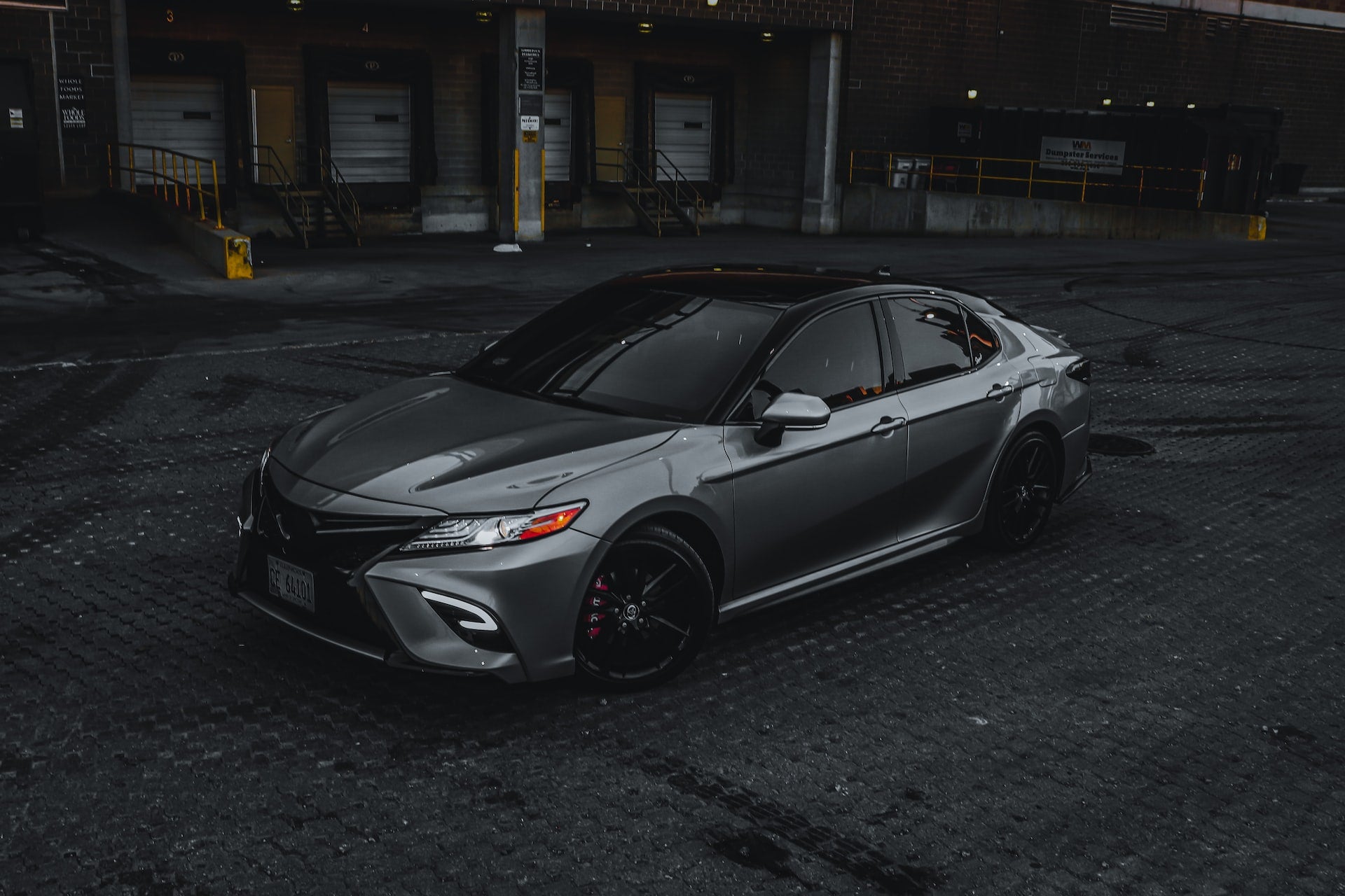grey toyota camry parked at night
