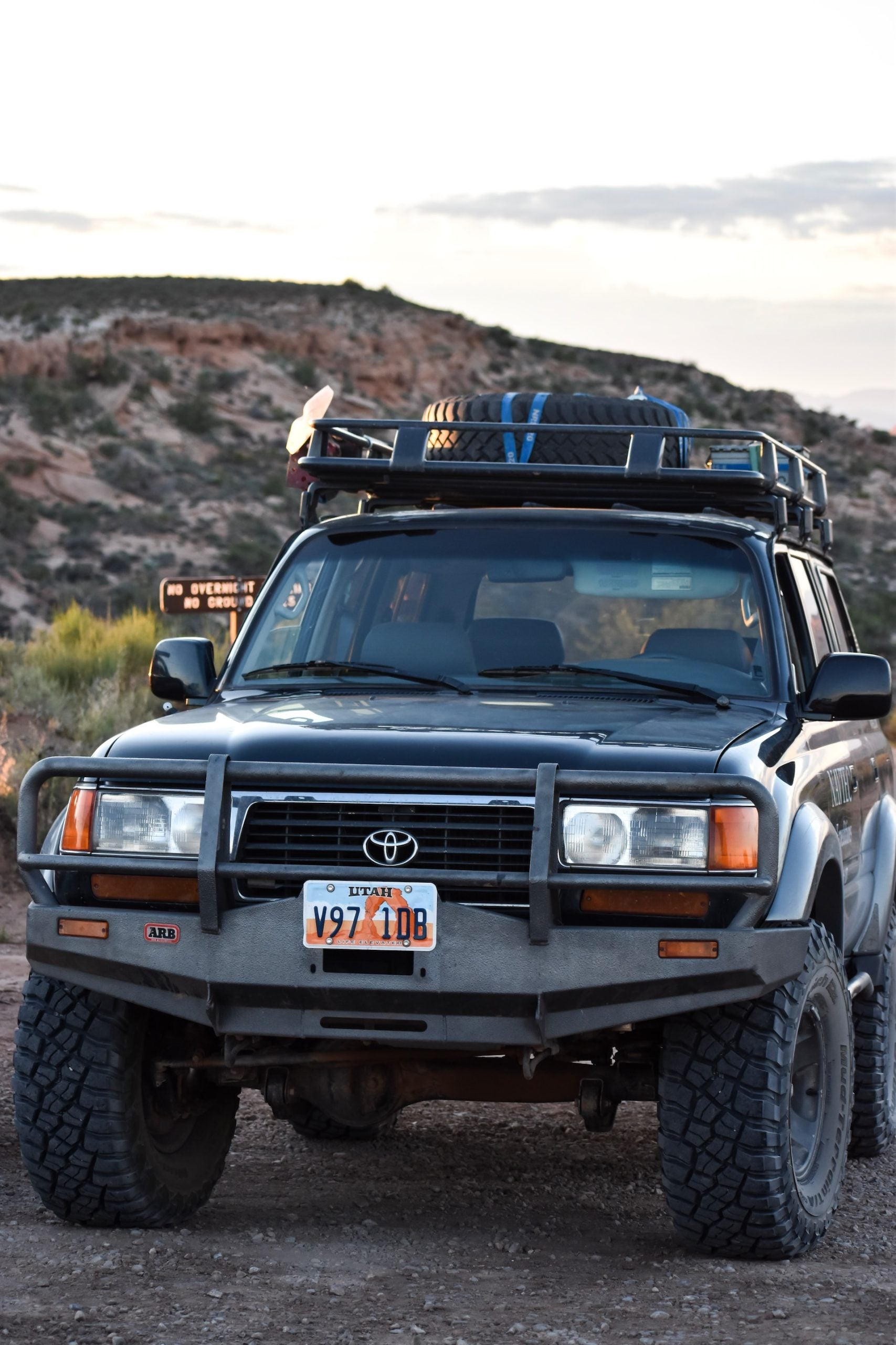 Toyota car in the mountains with luggage on its overhead
