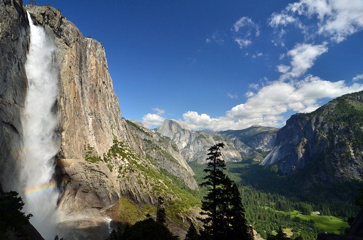 Open valley view with a waterfall to the left from a scenic hike in California.