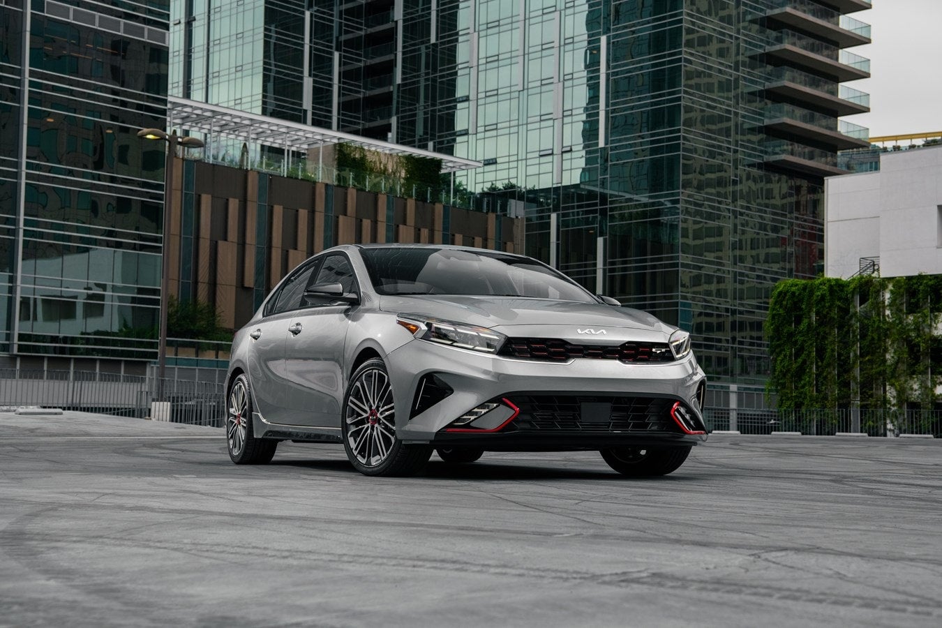 Silver pre-owned Kia Forte parked on a city street
