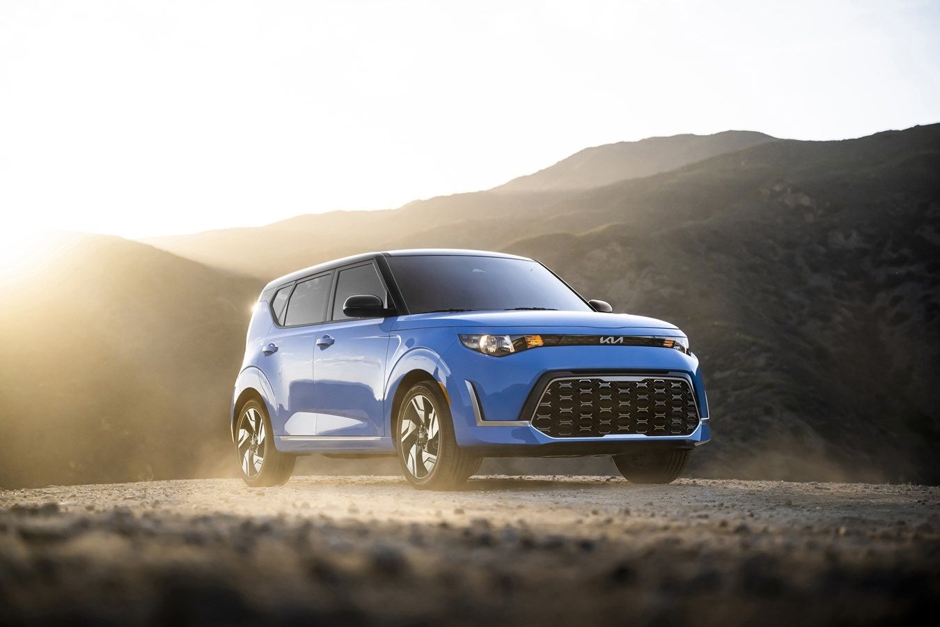Blue 2024 Kia Soul parked on a mountain