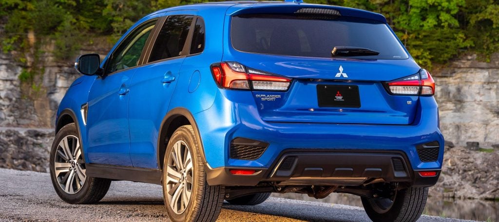 a blue mitsubishi outlander facing away from the camera