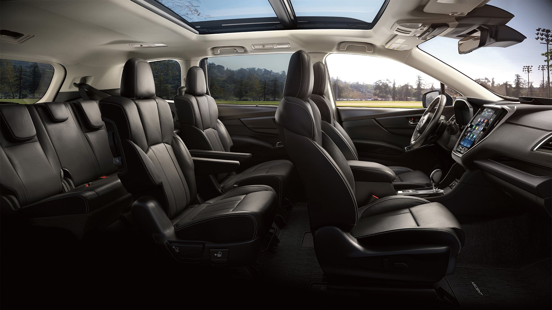 The spacious interior of a Subaru Ascent featuring premium leather seating and advanced dashboard technology.