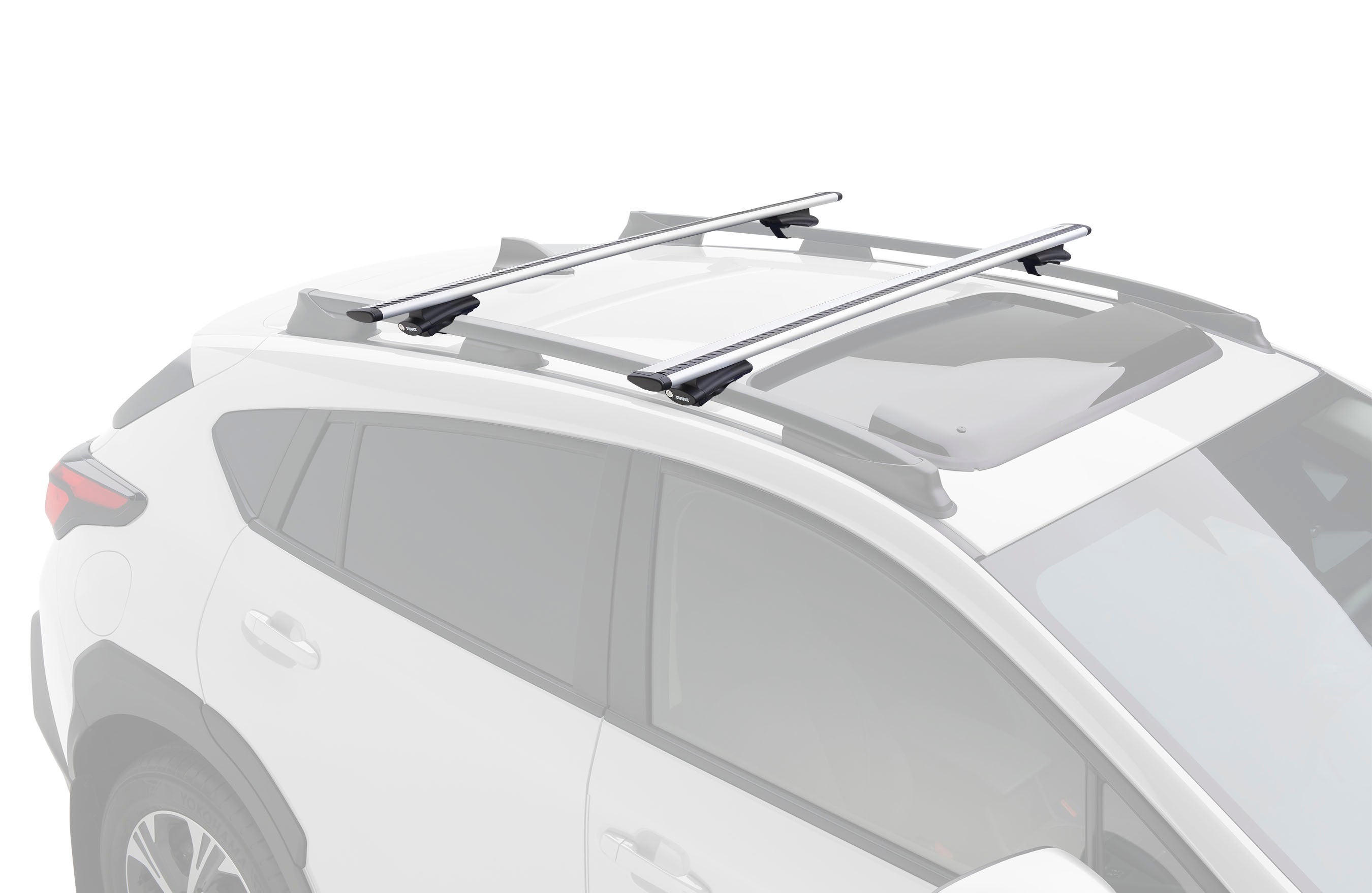 Thule crossbars mounted on the roof rails of a white SUV.