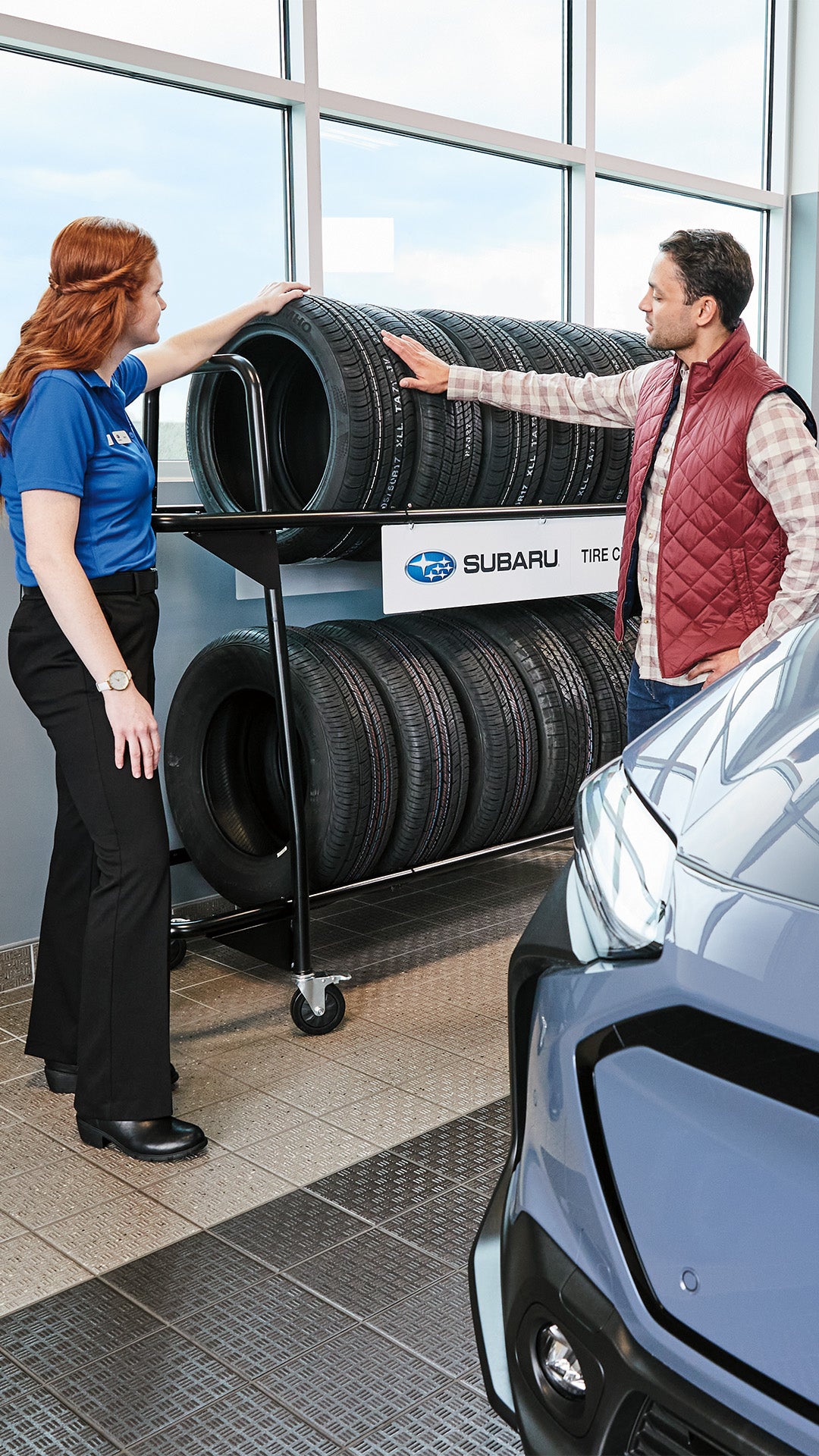 A clean, modern tire display in our Sunset Hills Subaru parts department showing various tread patterns.