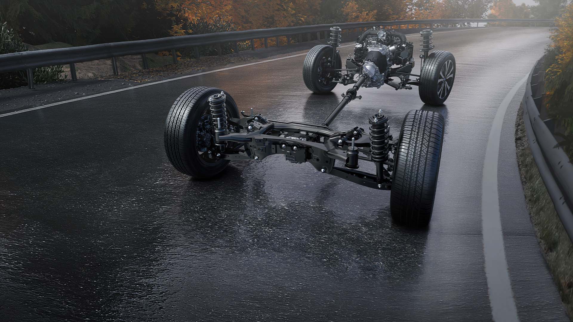Car chassis and suspension on wet road.
